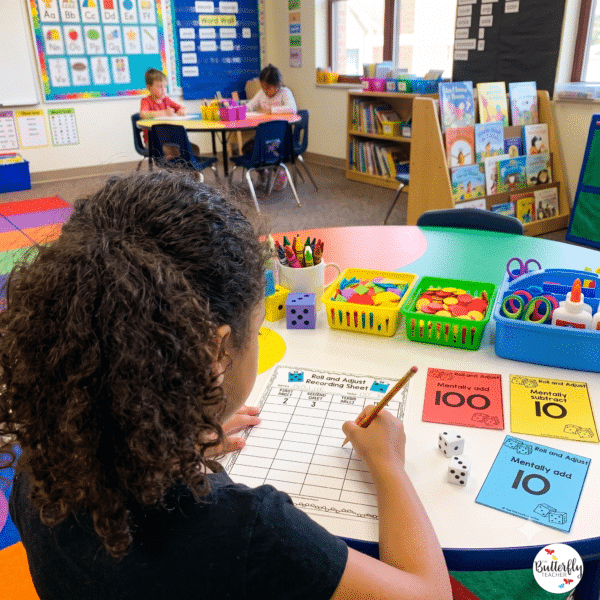 2nd grade math center girl completing roll and adjust